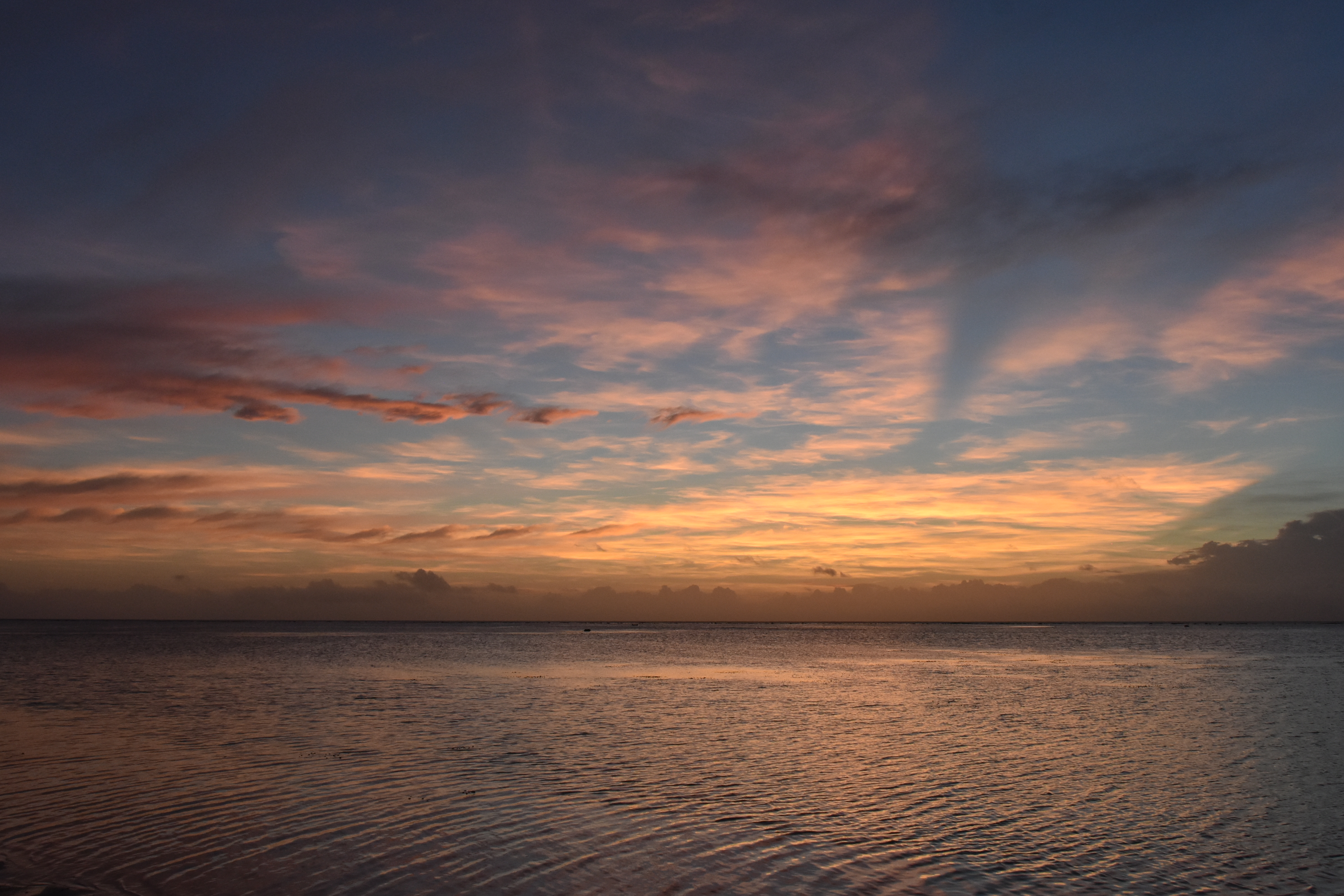 Sunset from the north side of Rarotonga Island, Cook Islands, South Pacific.